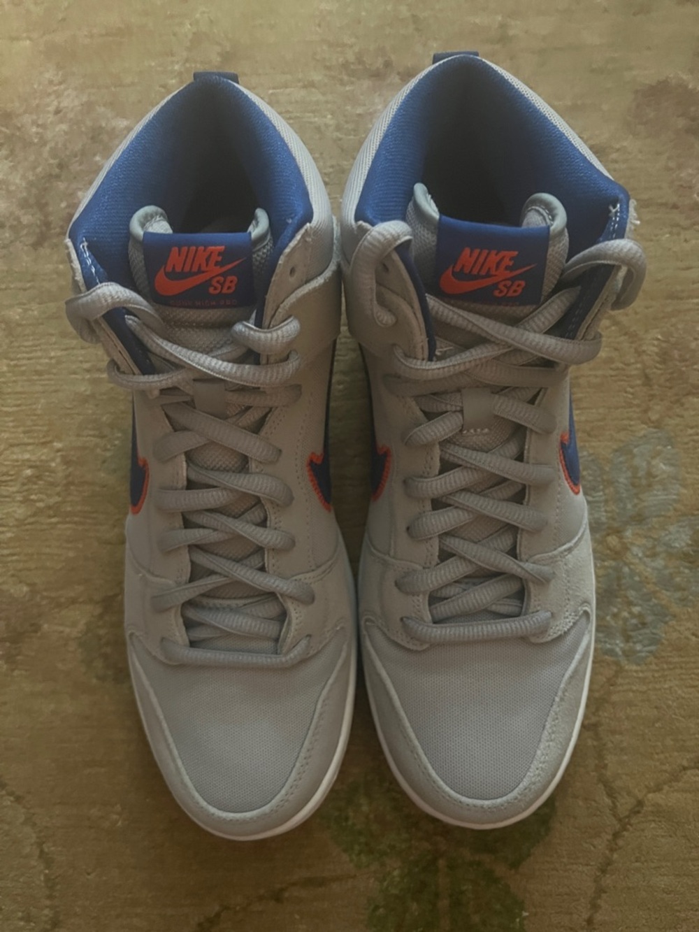 Nike SB Light Gray High-Top Sneakers with Blue Lining & Orange Swoosh